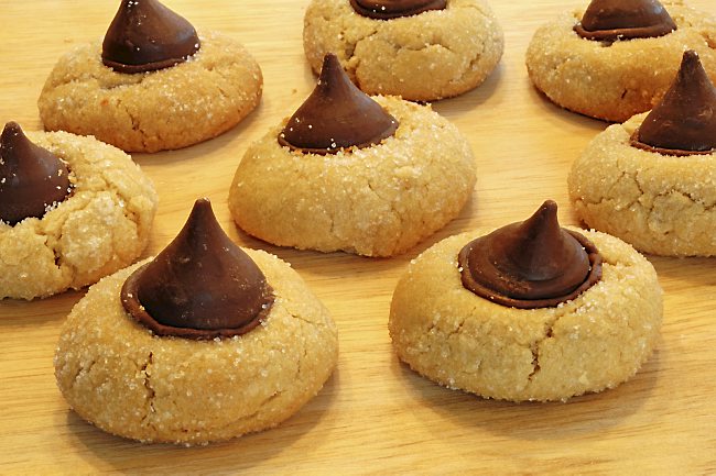 Peanut Butter Blossoms Cookies on a Wooden Cutting Board